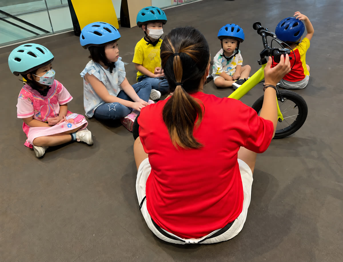 Young children learning together during a balance-bike class