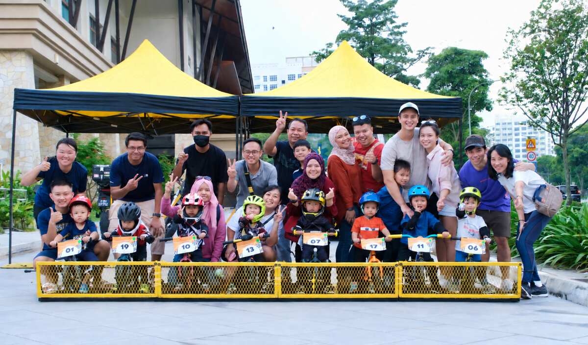 Young riders and their families celebrating together after a community event